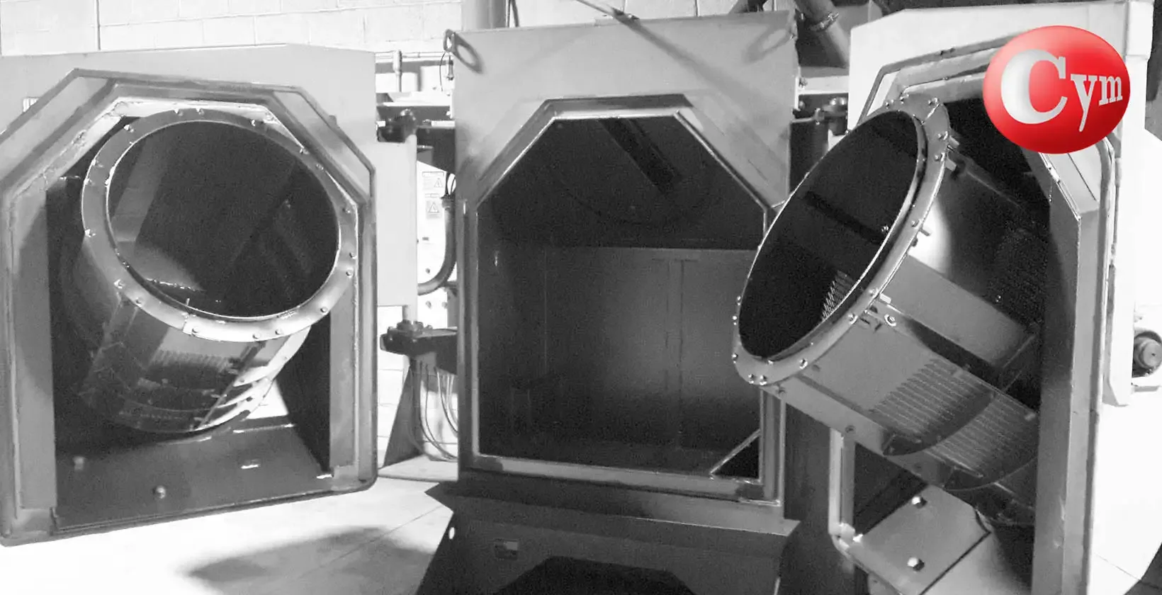 Interior granalladora LT-TAM 60-2P-1TR 20HP CYM — doble puerta abierta — tambores con paletas — APISA Fasteners México