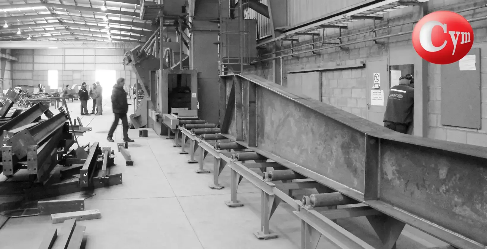 CYM PER-I 8x17 – 31" × 67" (800 × 1,700 mm) – 4 angled blast wheels – industrial building beam entering blast machine – Inzama Potes, Argentina