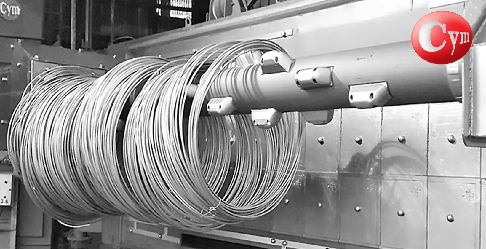 CYM COIL 4 – mandrel with expanding buckets opening wire coil loops, MN wear liner visible · Borroni, Argentina
