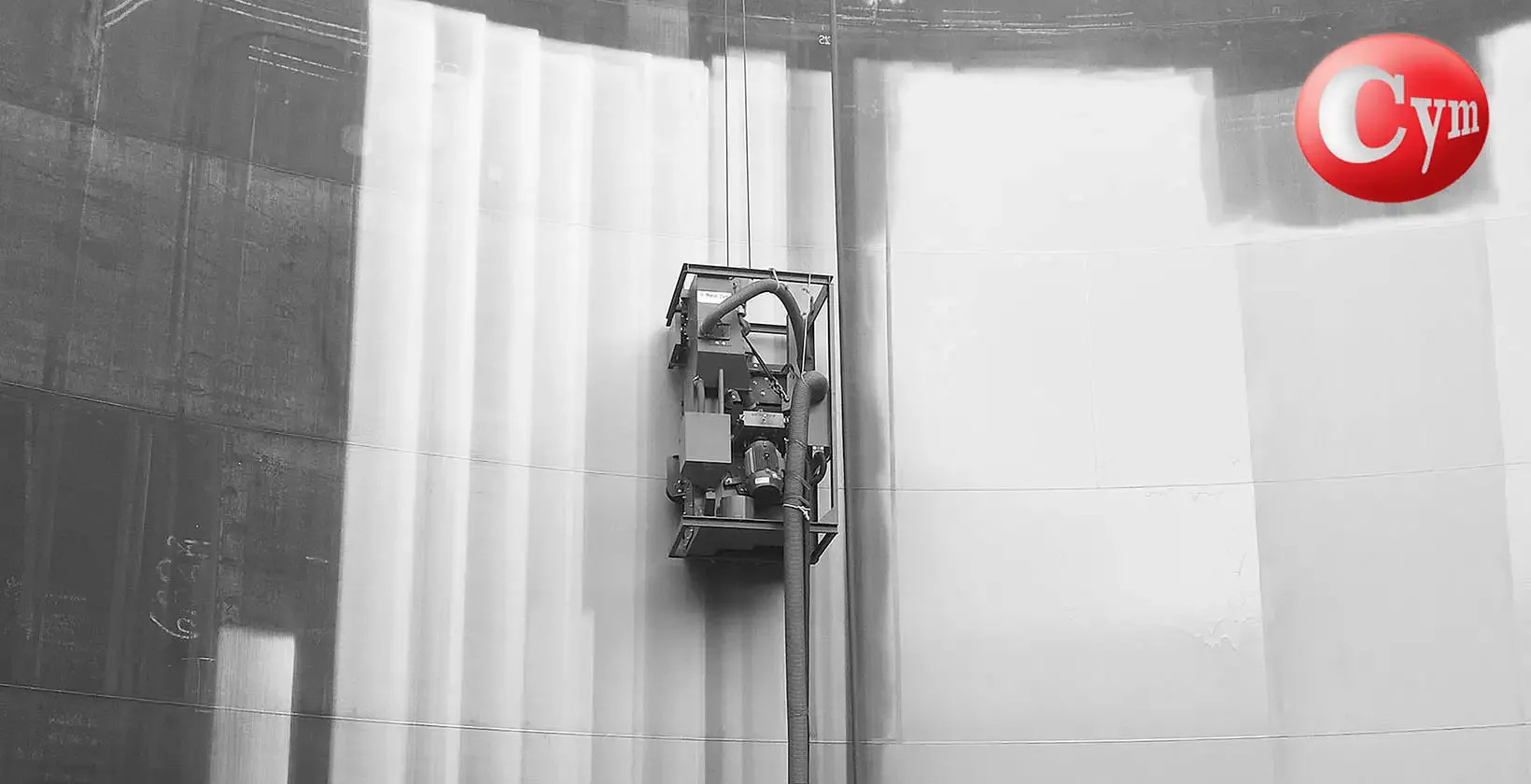 CYM Materiales portable blast machine ascending by cable on curved tank interior wall, integrated dust collector 30 HP