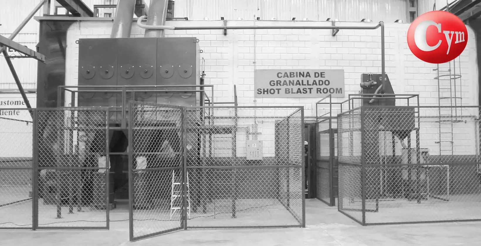 CYM Materiales ARC Stationary abrasive separator next to turbine blast room with dust collector and external installation